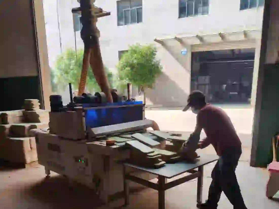 Panels after cutting going through dust extraction