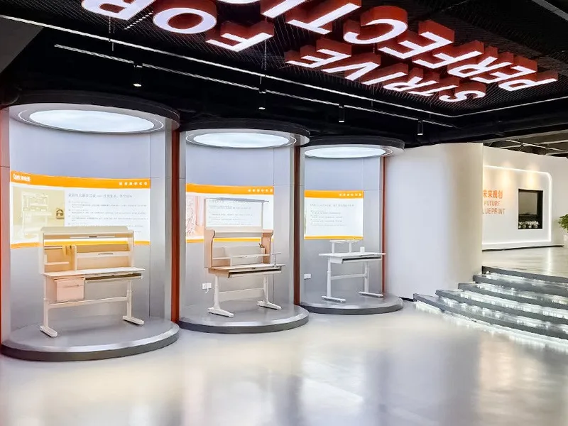 Showroom — study desks on lit display plinths